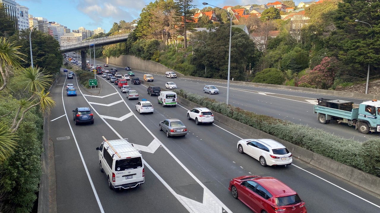 Cars, vans and trucks on a motorway. 