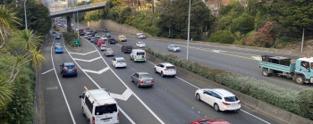 Cars, vans and trucks on a motorway. 