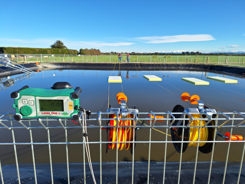 A photograph of an effluent pond with an effluent treatment system.