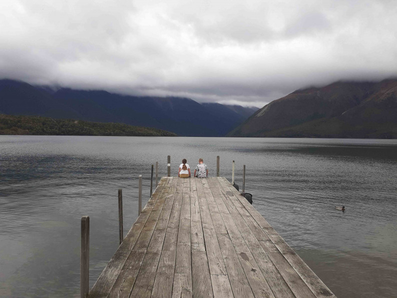 Boy and girl on a dock