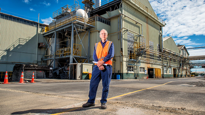 A man in high visibility clothing outside the Whakatāne Mill