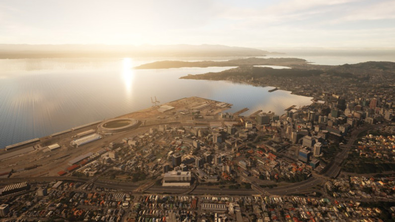 An aerial view of Wellington city showing the harbour, stadium and central city.